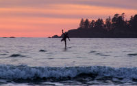 FREE wallpaper-Sunrises-Sunsets-60-Sets-Surfer-at-Chesterman-Beach-Tofino-B.C.-2009-01-14-WS